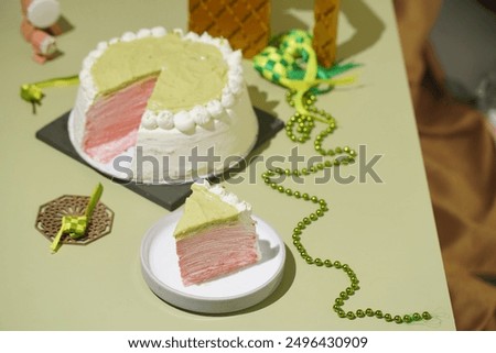 Similar – Image, Stock Photo Matcha cheesecake on pink background. Single slice of cake