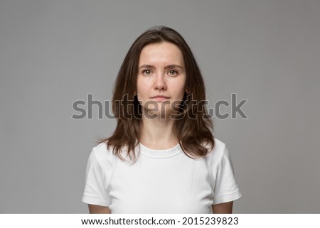 Similar – Image, Stock Photo Serious female with makeup and freckles on nose gently and looking at camera