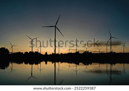 Similar – Image, Stock Photo Rotating windmill generating renewable energy wind power at land