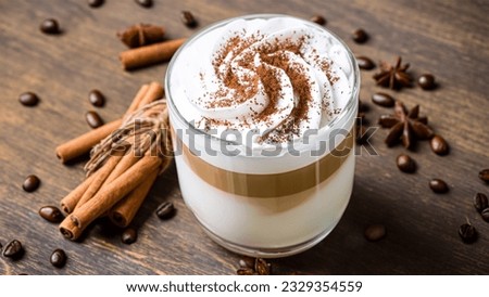 caffe latte with whipped cream, cinnamon and anise in a glass Foto d'archivio © 