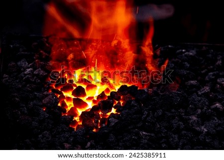 Similar – Image, Stock Photo Blacksmiths forging hot metal with hammer in workshop