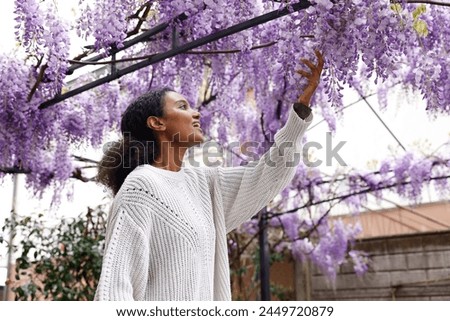 Similar – Image, Stock Photo Gorgeous woman touching columns in park