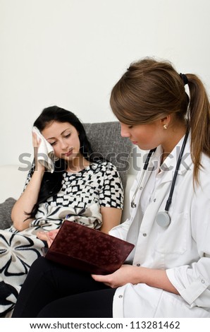 Female doctor visiting patient at home
