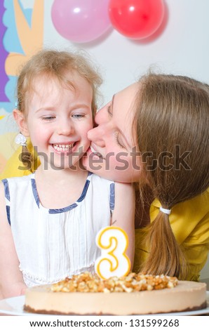 Little girl and her mom celebrating birthday