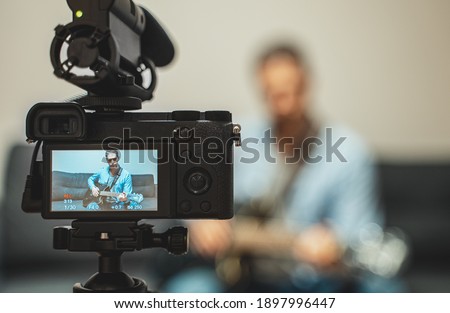 Image, Stock Photo Man filming a vlog with camera in the city