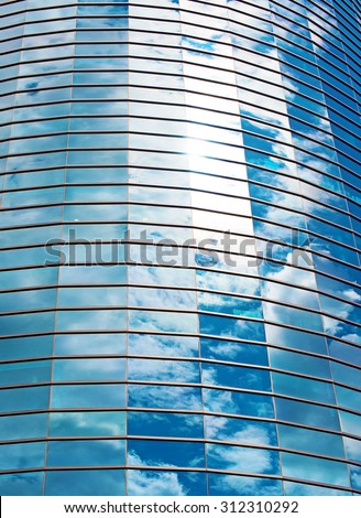 Modern round glass building in the city.