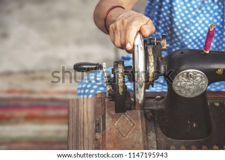 Similar – Foto Bild Weibliche Ernte mit Nähmaschine zu Hause