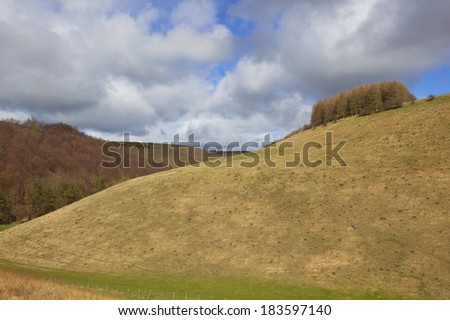 springtime weather with shower clouds over the rolling yorkshire wolds landscape of cot nab
