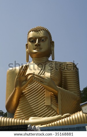sitting figure of buddha at dambulla in sri lanka