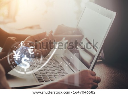 Two businesswoman uses laptop computer, world currencies, wallet cryptocurrency on virtual screen, fintech financial technology, internet payment, money exchange, digital banking concept Photo stock © 
