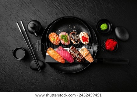 Similar – Image, Stock Photo A stylish chef in a black jacket prepares tasty salad with ripe figs, goat Chevre cheese, fresh cucumber roll, beetroot and mustard leaves with tomato sauce. Restaurant dish. Delicious food