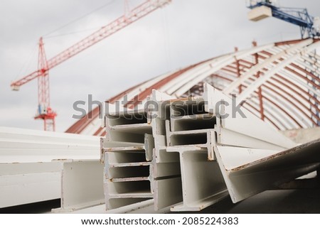 I-beam steel painted white lay piles on concrete, Raw materials used in building construction. Steel structure construction, Photo of I-beam used in steel frame construction. I-beam steel.