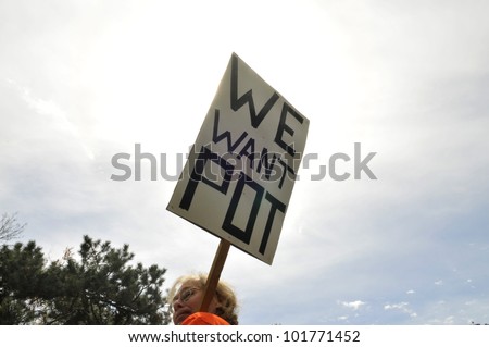 TORONTO - MAY 5: A Marijuana activist holding a sign and demanding \