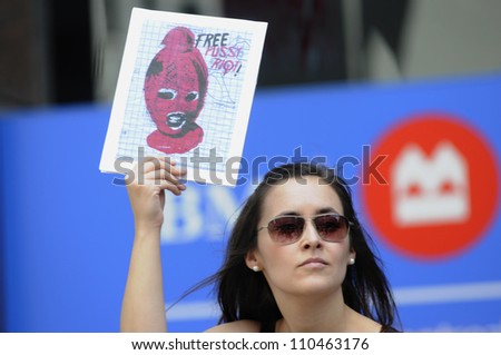 TORONTO -AUGUST  17: A woman holds a placard  during a protest rally organized to free \