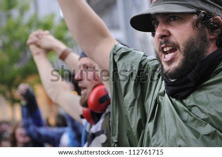 TORONTO-JUNE 26:   Protesters shouting and yelling against the police officers who didn\'t allow them to enter the summit area during the G20 Protest on June 26 2010 in Toronto, Canada.