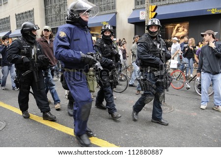 TORONTO-JUNE 26:  Riot police marching  the streets during the G20 Protest on June 26, 2010 in Toronto, Canada.