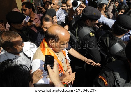 NEW DELHI-MAY 16:  BJP party president  Rajnath Singh walking out of an auditorium after a press conference after his party won the Indian National election on May 17, 2014 in New Delhi , India.