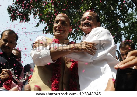 NEW DELHI-MAY 16:  BJP president Rajnath Singh being hugged by  Venkaiah Naidu  after BJP won the historic Indian National election on May 16, 2014 in New Delhi , India.