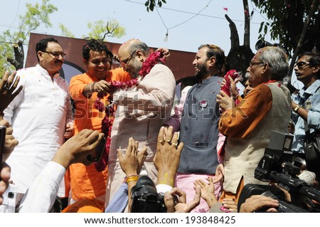 NEW DELHI-MAY 16:  Amit Shah the general secretary of the BJP party being garlanded by supporters  after BJP won the Indian National election on May 16, 2014 in New Delhi , India.
