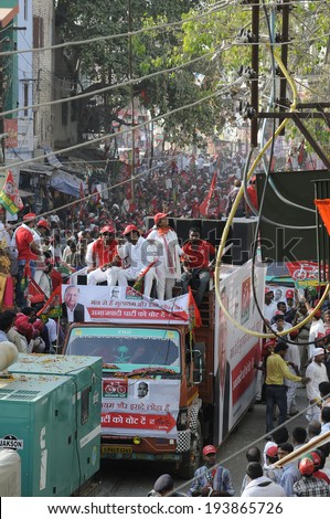 VARANASI-MAY 10:  Samajwadi Party  supporters riding an open vehicle during an election rally of  UP Chief Minister Akhilesh Yadav  on May 10, 2014 in Varanasi , India.