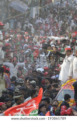 VARANASI-MAY 10:   People flocked the streets during an election rally of UP Chief Minister Akhilesh Yadav  on May 10, 2014 in Varanasi , India.
