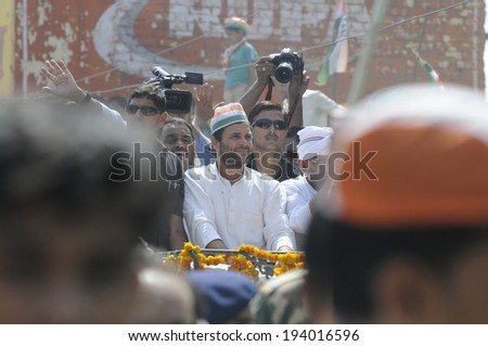 VARANASI - MAY 10: Rahul Gandhi along with his security guards during a road show  to support local Congress candidate Mr. Ajay Rai on May 10, 2014 in Varanasi , India.
