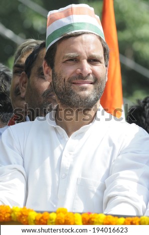 VARANASI - MAY 10: Rahul Gandhi wearing a Congress cap during a road show  to support local Congress candidate Mr. Ajay Rai on May 10, 2014 in Varanasi , India.