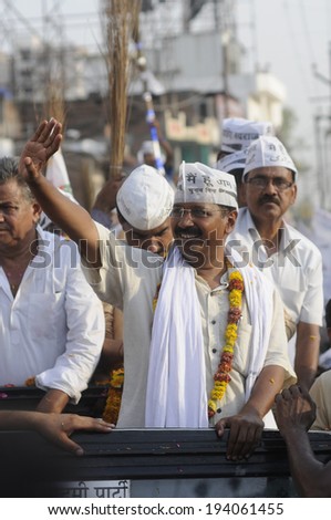 VARANASI - MAY  9: Arvind kejriwal waiving towards the crowd  during a political rally on May  9, 2014 in Varanasi , India.