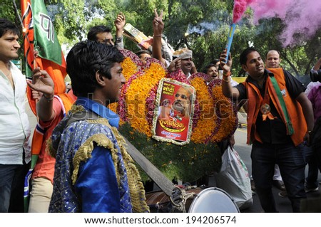 NEW DELHI-MAY 16:  BJP party workers dancing and singing  after wining the Indian National election on May 16, 2014 in New Delhi , India.