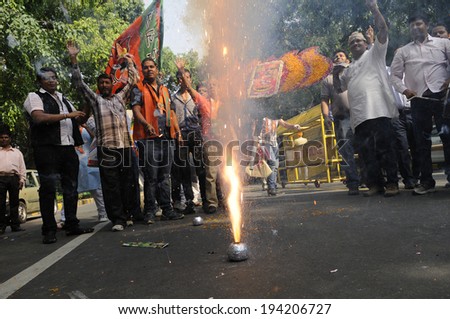 NEW DELHI-MAY 16:  BJP supporters lighting firecrackers on the streets after BJP won the Indian National election on May 16, 2014 in New Delhi , India.