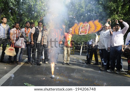 NEW DELHI-MAY 16:  BJP supporters lighting firecrackers on the streets after BJP won the Indian National election on May 16, 2014 in New Delhi , India.