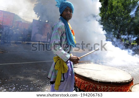 NEW DELHI-MAY 16:  Traditional Indian drummer  performing  after BJP won the Indian National election on May 16, 2014 in New Delhi , India.