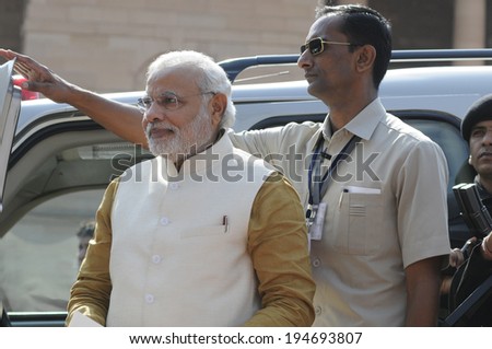 NEW DELHI-MAY 20:  Prime Minister Narendra Modi  being guarded towards press conference at Rashtrapati Bhavanon May 20, 2014 in New Delhi , India.