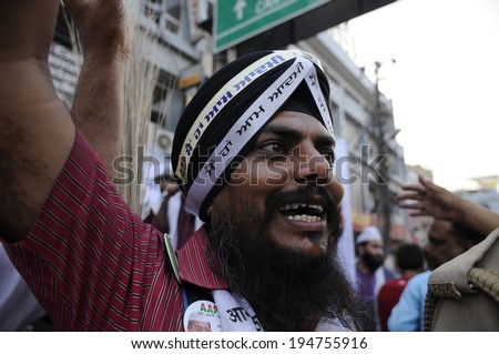 VARANASI - MAY 7: A Punjabi  AAP supporter dancing during a political rally on May  7, 2014 in Varanasi , India.