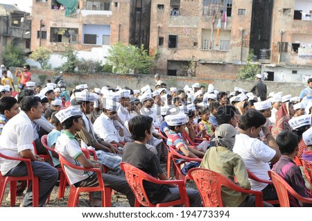 VARANASI - APRIL 27: AAP supporters listening to Arvind Kejriwal during a political meeting  on April  27, 2014 in Varanasi , India.