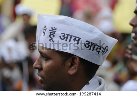 VARANASI - APRIL  29 : An AAP supporter wearing a cap which says\