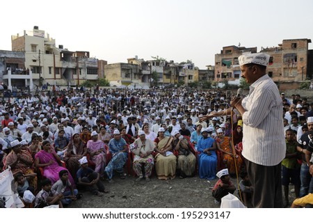 VARANASI - APRIL  27 : Arvind kejriwal addressing a crowd in a local park during a political meeting on April  27 , 2014 in Varanasi , India.