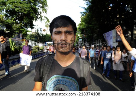 KOLKATA- SEPTEMBER 18: A student marching in a rally during a student protest rally organized by Jadavpur university  students against police atrocities on September 18, 2014  in Kolkata, India.