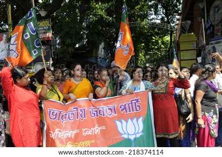 KOLKATA- SEPTEMBER 18: BJP woman cell protesting outside JU entrance during a student protest rally organized by JU students against police atrocities on September 18, 2014  in Kolkata, India.