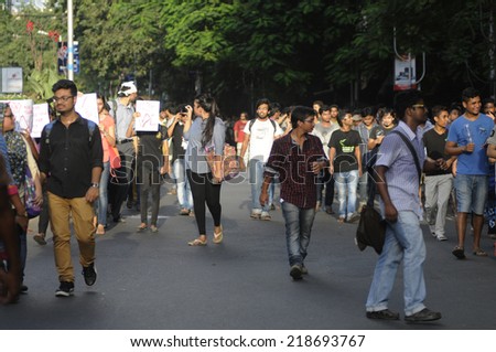 KOLKATA- SEPTEMBER 18: Students walking on the streets  during a student protest rally organized by Jadavpur university students against police atrocities on September 18, 2014 in Kolkata, India.