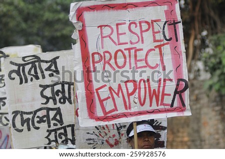 KOLKATA -DECEMBER 16 :People with banners asking to respect and empower women during a rally to remember the gang raped victim from New Delhi in the year 2012 - on December 16, 2014 in Kolkata ,India.