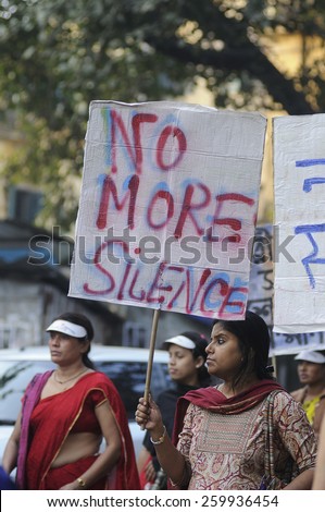 KOLKATA - DECEMBER 16 : A woman asking fellow women to speak up during a rally to remember the gang raped victim from New Delhi in the year 2012 - on December 16, 2014 in Kolkata , India.