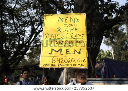 KOLKATA - NOVEMBER 15 :An old man holding a sign which asks to separate between rapists and men during a rally to celebrate the International Men's Day on November 15, 2014 in Kolkata, India.
