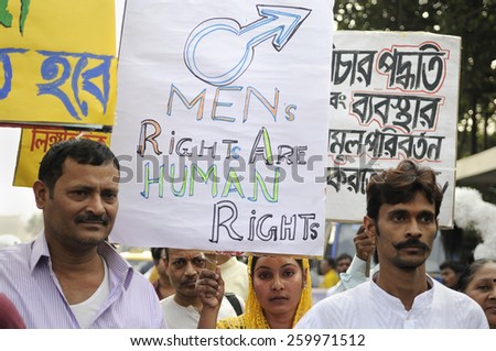 KOLKATA - NOVEMBER 15 :Participants with signs advocating that men\'s right are human rights while marching in a rally to celebrate the International Men\'s Day on November 15, 2014 in Kolkata, India.