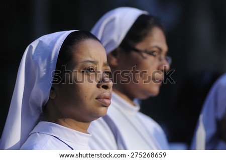 KOLKATA - MARCH 16 : Two Christian Nun with  plaintive looks during a candle light vigil to protest gang rape of an elderly nun on March 16, 2015, at Allen Park in Kolkata, India.