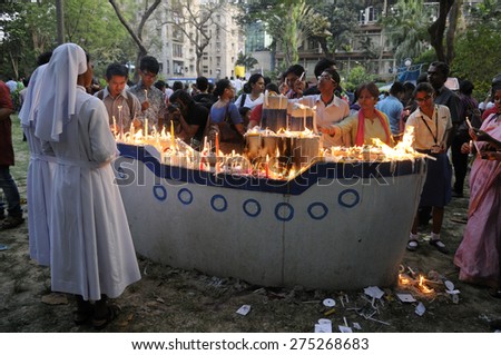 KOLKATA - MARCH 16 : Christian Nuns along with mourners lighting candles during a candle light vigil to protest gang rape of an elderly nun on March 16, 2015, at Allen Park in Kolkata, India.