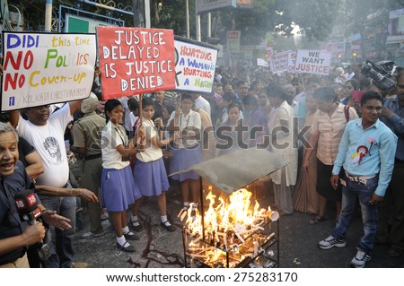 KOLKATA - MARCH 16 : People of all ages and religion with signs and banners came on to the streets to protest gang rape of an elderly nun  on March 16, 2015 at Allen Park in Kolkata, India.
