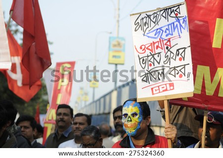 KOLKATA - JANUARY 24: Protesters carrying sign demanding to cancel Obama\'s three day visit India to attend IndiaÃ¢Â?Â?s Republic Day parade on January 24, 2015 in Kolkata, India.