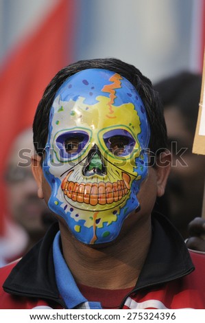 KOLKATA - JANUARY 24:  A protestor wearing a devilish skull mask to protest Obama\'s three day visit India to attend India\'s Republic Day parade on January 24, 2015 in Kolkata, India.