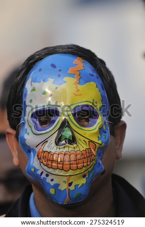 KOLKATA - JANUARY 24:  A protestor wearing a devilish skull mask to protest Obama's three day visit India to attend IndiaÃ¢Â?Â?s Republic Day parade on January 24, 2015 in Kolkata, India.